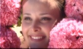 bride face surrounded by pink flowers at BeckenRidge Vineyard in Oregon, from wedding video sample clip by Focal Point Digital Media